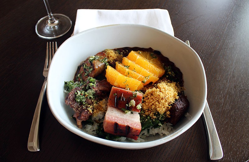The feijoada is served with five different meats including calabrese sausage, braised beef, pork belly, pork cheek and ham hock. - LEXIE MILLER