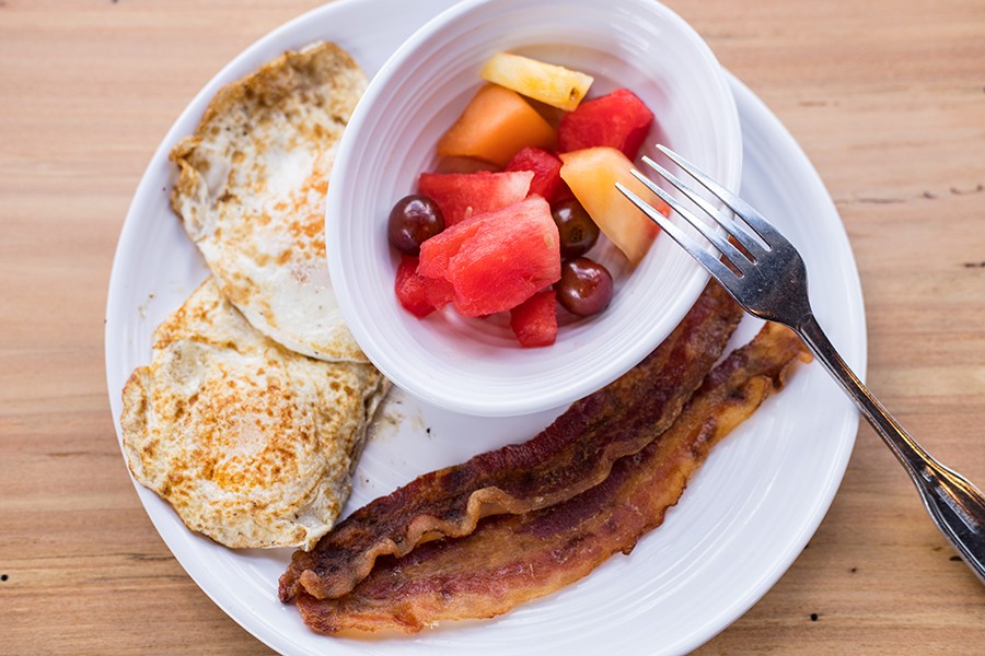 The waffle platter comes with two eggs, bacon and fresh fruit. - MABEL SUEN