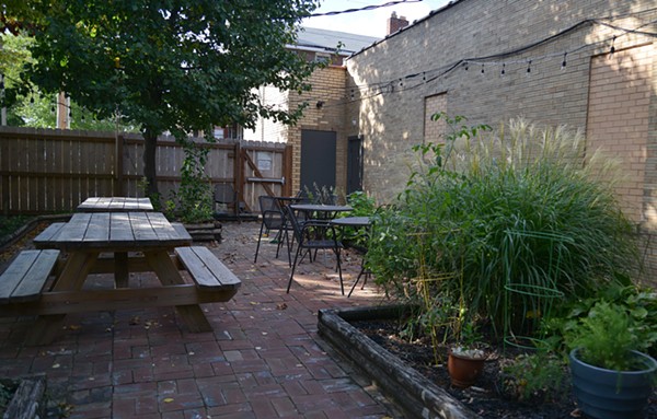 The patio out back seats around 25 at various picnic and cast iron tables. - Tom Hellauer
