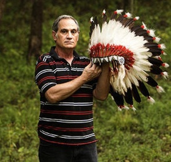 Kevin Airis with an eagle-feather headdress the Science Center returned to him in 2007. - Jennifer Silverberg for RFT