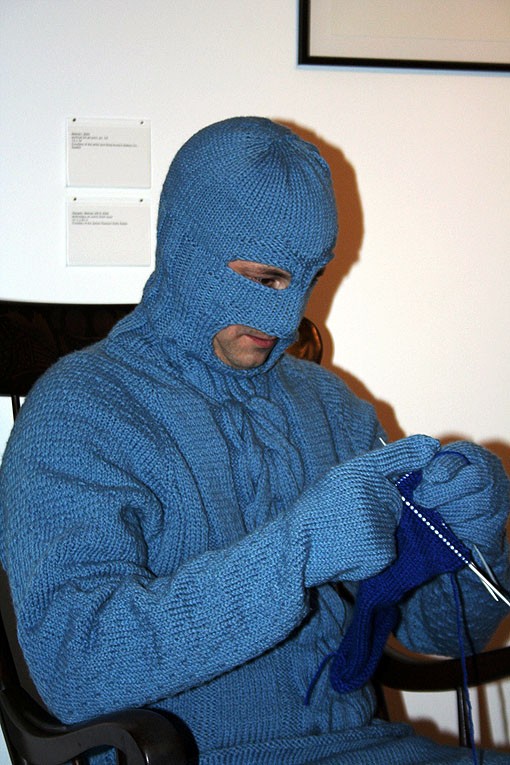 Mark Newport as Sweaterman, knits while in-character on Friday night. - Photo: Emily Good