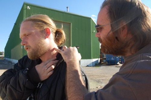 Brett Dagoberg checks his friend's neck for puncture wounds. - Lindsay Toler