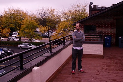 Dave Rutledge taking a break from his hard work (twittering) on Woot's new deck overlooking a lovely parking lot. - PHOTO BY: BILL STREETER