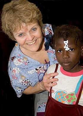 Dr. Patricia Wolff and one her Haitian patients. - Image source