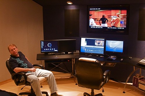 Local filmmaker Jack Snyder checks the mix of a project in Shock City's video suite. (click image for larger view) - Photo by: Bill Streeter