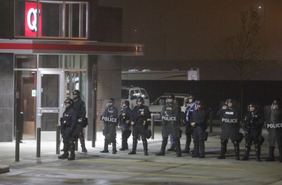 St. Louis cops in riot gear guard a QuikTrip in the Grove on October 12. Three days before, an officer shot and killed eighteen-year-old Vonderrit Myers Jr. - Danny Wicentowski