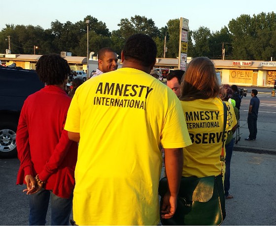Amnesty International out in Florissant last night. - JESSICA LUSSENHOP