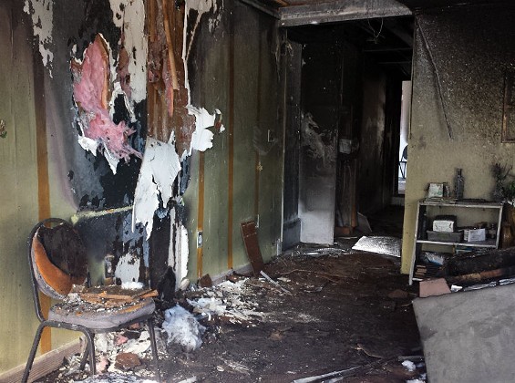Fire damage in the front room of the Flood Church on West Florissant. - JESSICA LUSSENHOP