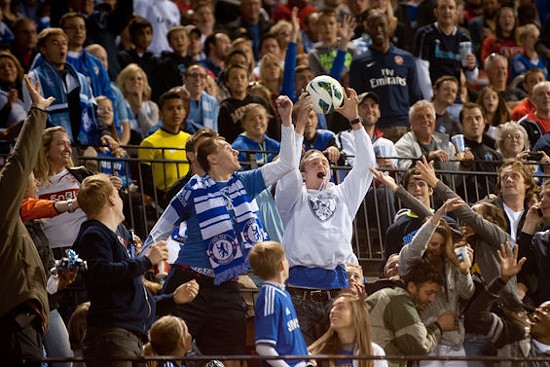 A lucky fan catches the ball at the friendly between Chelsea FC and Manchester City FC. - JON GITCHOFF