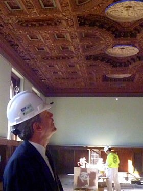 Waller McGuire admires the restored ceiling in the arts collection room. - Aimee Levitt