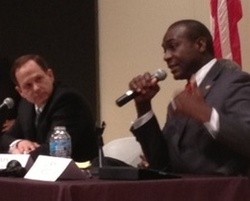 Francis Slay listens to Lewis Reed at a debate. - Sam Levin
