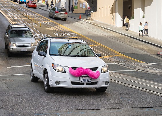 Lyft's pink mustaches are getting their day in court. - Urbanists on Flickr, cropped