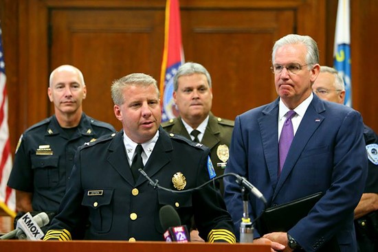 Police Chief Sam Dotson with Governor Jay Nixon, St. Louis County Police Chief Tim Fitch and others discussing their opposition to the legislation last month. - Facebook / SLMPD