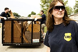 Laura Smith of Landlords Moving Service stands guard during an eviction - Photo by Jennifer Silverberg