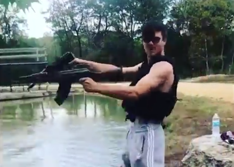 VladHQ, firing guns into a lake while threatening Lil Xan. - SCREENSHOT FROM THE VIDEO BELOW
