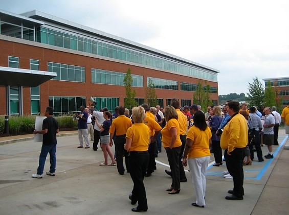 Protestors at Monday's rally outside Express Scripts' headquarters near UMSL - KASE WICKMAN