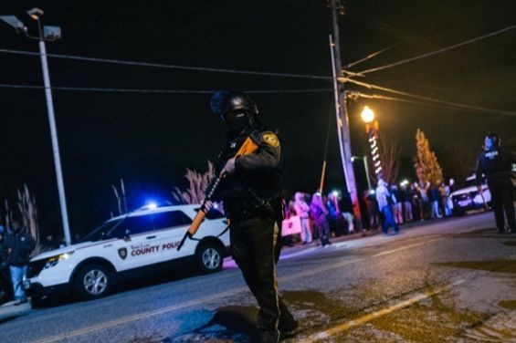 A police officer patrols Ferguson protests. Check out more photos from Ferguson in our RFT slideshow. - Bryan Sutter