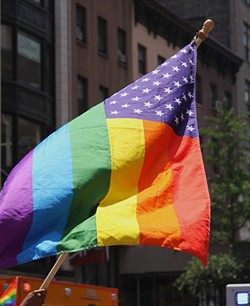 Two men harassed a queer couple because their rainbow flag has stars and stripes. - JMAZZOLAA ON FLICKR