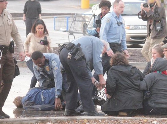 Ferguson police officers arrested four protesters at the area's Walmart. - Danny Wicentowski