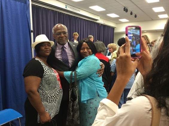 County Executive Charlie Dooley poses with supporters at the debate before the August 5 primary. - Lindsay Toler