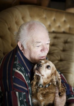 Cowboy, pictured here with his owner Floyd Dunlap, spent most of his life in the kind of puppy mill that would be made illegal by Prop B. State lawmakers are now seeking to gut the voter-approved initiative. - Jennifer Silverberg