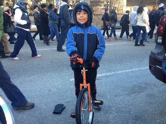 Photos: Eight-Year-Old Finn McNamee Marches on Unicycle in St. Louis MLK Parade