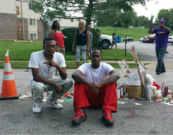 Michael Brown's cousins Maurice Ewings and Anthony Livingston at the spot where Brown was killed. - Jessica Lussenhop