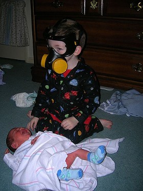 If you have to change a diaper, do this. Don't crush the kid. - IMAGE SOURCE