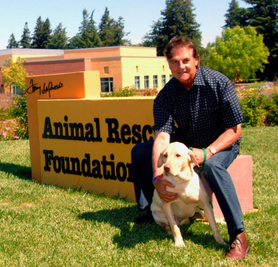 La Russa poses with Mustard outside his animal shelter.