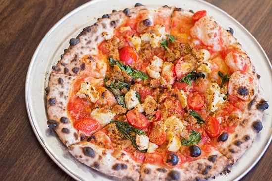 Pizzeoli's "Baba" with fresh tomato sauce, house cashew ricotta, fresh basil, garlic, vegan Parmesan, extra virgin olive oil and vegan ground beef. | Photos by Mabel Suen