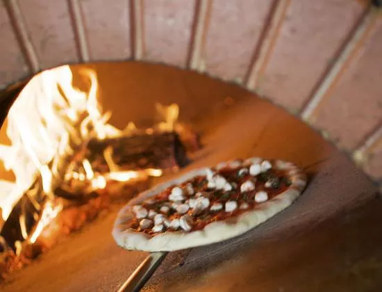 A pie goes into the oven at Peel. - Jennifer Silverberg