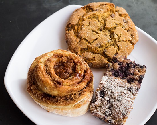 Cinnamon roll, peanut-butter chocolate-chip cookie, blueberry quick bread baked in house.