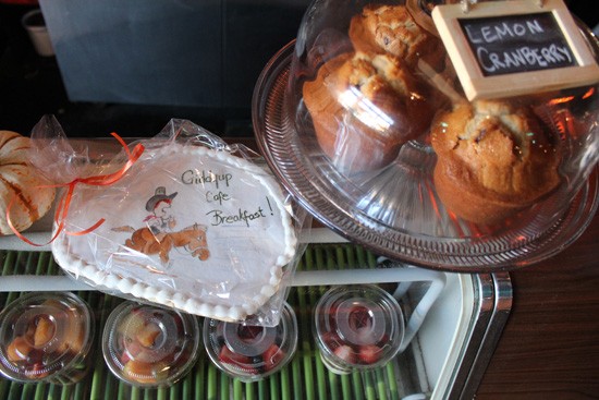 Freshly baked muffins and fruit parfaits at Giddy Up Breakfast Bar. - Mabel Suen