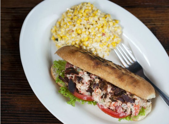 The Crawfish salad sandwich, prepared with oven dried pancetta, tomatoes, and basil with a side of cream corn at Sassy Jac's. - Jennifer Silverberg