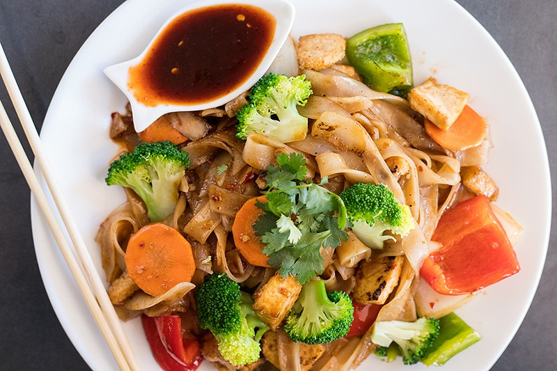 “Drunken noodles” coat tofu, peppers, onion, carrots and broccoli with a delicious umami fish-sauce flavor. - MABEL SUEN