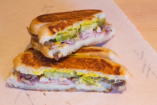 The "Castro" with mojo-braised pork, Butchery-smoked ham, Swiss cheese, pickles and mustard.