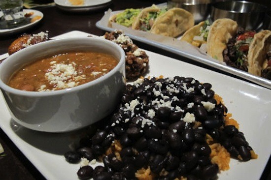 Charro beans and black beans with red chile rice at Vida Mexican Kitchen y Cantina. - Rease Kirchner