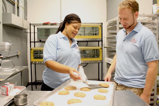 Managing partners Tamika Moore and Jonathan Weinberg in the  kitchen - Mabel Suen