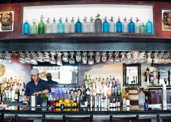 Co-owner Terry Oliver behind the bar at Tripel. | Jennifer Silverberg