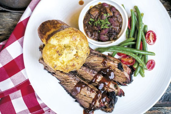 Brisket plate with a side of green bean and tomato salad and brisket chili. - Jennifer Silverberg