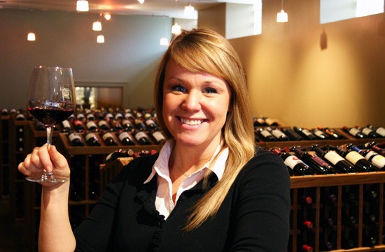 Renee Skubish of West End Wines demonstrates the best part of her job. - Katie Moulton