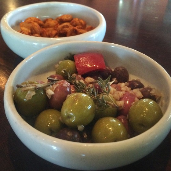 Modesto's marinated olives and spiced Marcona almonds. | Patrick J. Hurley
