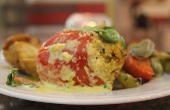 Tomatoes stuffed with a goat cheese sauce. - Nancy Stiles