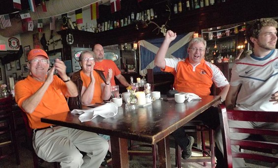Netherlands fans cheer for goals...and pasties. - photos by Keegan Hamilton