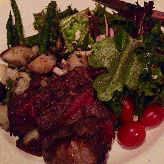Steak salad with asparagus tips, roasted fingerling potatoes, mixed greens, roasted tomato vinaigrette, Gorgonzola cheese and red onion.| Nancy Stiles