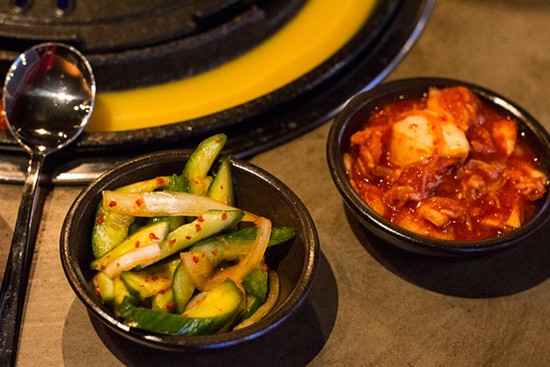 Cucumber and napa kimchi dishes.