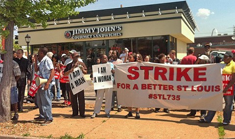 Protesters gather outside Jimmy John's in Soulard yesterday. More strikes are scheduled for today.