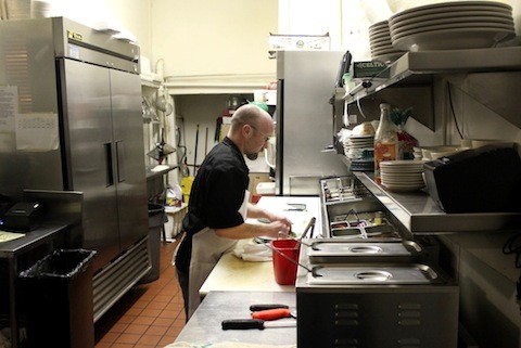 Andrew Ladlie in the very small Sassy JAC's kitchen | Kaitlin Steinberg