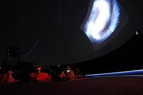 Kids at the McDonnell Planetarium, learning stuff about the night sky. - Image source