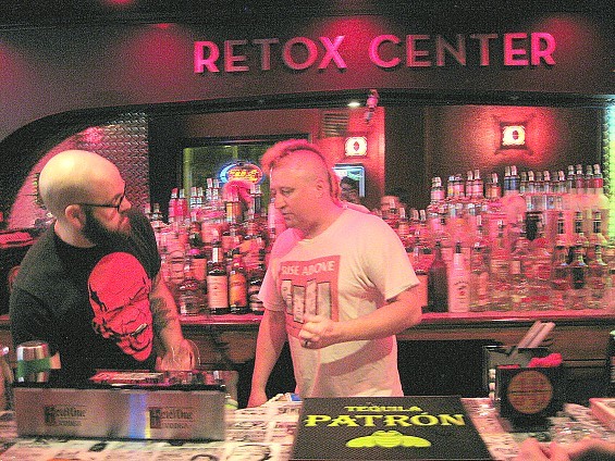Silver Ballroom owner Steve "Doc" Dachroeden tending bar with Justin. - Diana Benanti